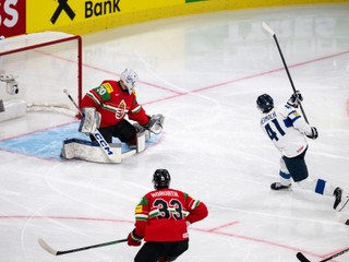 Hungary's goaltender Adam Vay, left, with a save against Finland's Ville Heinola during the 2026 IIHF Men's Ice Hockey World Championship preliminary round group A game between Hungary and Finland, in Zurich, Switzerland, Saturday, May 16, 2026. (Andreas Becker/Keystone via AP)