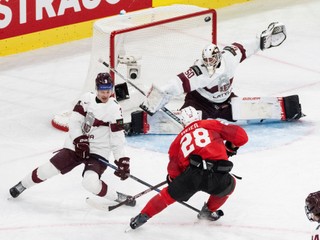 Switzerland's Timo Meier (28) misses a chance against Latvia's Alberts Smits, left, and Latvia's goaltender Kristers Gudlevskis, right, during the Group A preliminary round game between Switzerland and Latvia at the men's ice hockey world championship, Saturday, May 16, 2026, in Zurich, Switzerland. (Claudio Thoma/Keystone via AP)