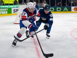 USA's Matt Coronato, left, and Finland's Henri Jokiharju in action during the Men's Ice Hockey World Championship preliminary round game between Finland and the USA in Zurich, Switzerland, Monday, May 18, 2026. (Claudio Thoma/Keystone via AP)