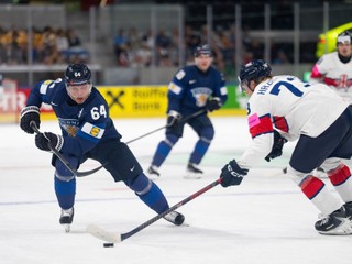 Great Britain's goaltender Mat Robson, right, makes a save against Finland's Patrik Puistola, left, during a Group A preliminary round game between Finland and Great Britain in Zurich, Switzerland, Friday, May 22, 2026. (Claudio Thoma/Keystone via AP)