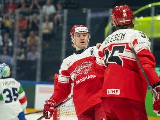 Denmark's Mikkel Aagaard, front left, celebrates after scoring his side's second goal during the 2026 IIHF Men's Ice Hockey World Championship preliminary round group B game between Denmark and Italy in Fribourg, Switzerland, Sunday, May 24, 2026. (Alessandro della Valle/Keystone via AP)