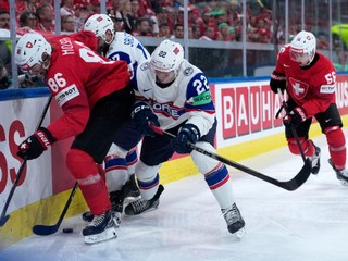 Switzerland's Janis Moser (86) challenges with Norway's Mats Zuccarello (22) during the 2026 IIHF Men's Ice Hockey World Championship semifinal match between Switzerland and Norway, in Zurich, Switzerland, Saturday, May 30, 2026, (AP Photo/Darko Bandic)