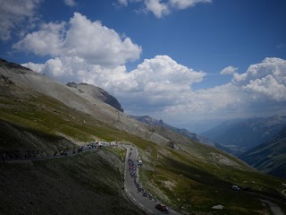 FILE - The pack climbs Col du Galibier pass during the twelfth stage of the Tour de France cycling race over 165.5 kilometers (102.8 miles) with start in Briancon and finish in Alpe d'Huez, France, Thursday, July 14, 2022. (AP Photo/Daniel Cole, File)