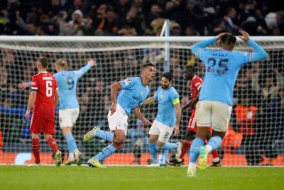 Manchester City's Rodrigo, center, celebrates after scoring the opening goal of his team during the Champions League quarterfinal, first leg, soccer match between Manchester City and Bayern Munich at the Etihad stadium in Manchester, England, Tuesday, April 11, 2023. (AP Photo/Dave Thompson)

- XCHAMPIONSLEAGUEX