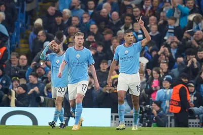 Manchester City's Rodrigo, right, celebrates after scoring the opening goal of his team during the Champions League quarterfinal, first leg, soccer match between Manchester City and Bayern Munich at the Etihad stadium in Manchester, England, Tuesday, April 11, 2023. (AP Photo/Dave Thompson)

- XCHAMPIONSLEAGUEX
