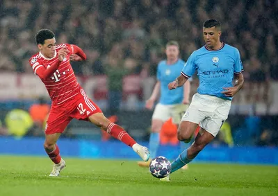 Bayern's Jamal Musiala, left, and Manchester City's Rodrigo go for the ball during the Champions League quarterfinal, first leg, soccer match between Manchester City and Bayern Munich at the Etihad stadium in Manchester, England, Tuesday, April 11, 2023. (AP Photo/Dave Thompson)

- XCHAMPIONSLEAGUEX