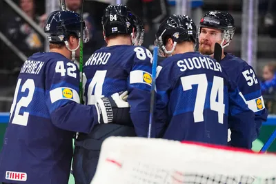 CORRECTS TEAMS   Finland's team players celebrate after Ville Pokka scored his side's third goal during the group A match between Finland and Denmark at the ice hockey world championship in Tampere, Finland, Tuesday, May 23, 2023. (AP Photo/Pavel Golovkin)