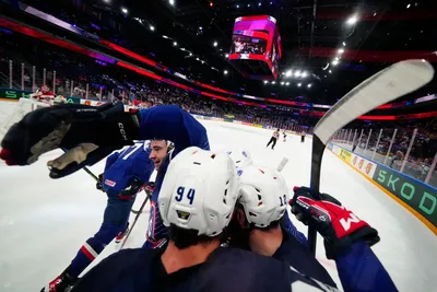 France's team players celebrate as Tim Bozon, centre back to the camera, scored the opening goal during the group A match between France and Austria at the ice hockey world championship in Tampere, Finland, Saturday, May 13, 2023. (AP Photo/Pavel Golovkin)