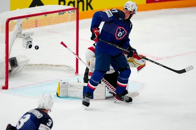 France's Sacha Treille scores his side's second goal past Austria's goalie David Madlener during the group A match between France and Austria at the ice hockey world championship in Tampere, Finland, Saturday, May 13, 2023. (AP Photo/Pavel Golovkin)