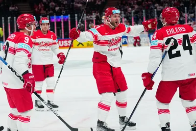 Denmark's team players celebrate as Nikolaj Ehlers, right, scored the opening goal during the group A match between Hungary and Denmark at the ice hockey world championship in Tampere, Finland, Saturday, May 13, 2023. (AP Photo/Pavel Golovkin)