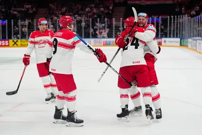 Denmark's team players celebrate as Nikolaj Ehlers, second from right, scored the opening goal during the group A match between Hungary and Denmark at the ice hockey world championship in Tampere, Finland, Saturday, May 13, 2023. (AP Photo/Pavel Golovkin)