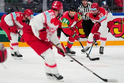 Denmark's Mathias Bau, right, and Hungary's Istvan Terbocs battle for the puck during the group A match between Hungary and Denmark at the ice hockey world championship in Tampere, Finland, Saturday, May 13, 2023. (AP Photo/Pavel Golovkin)