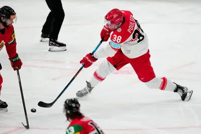 Denmark's Morten Poulsen, right, scores his side's third goal during the group A match between Hungary and Denmark at the ice hockey world championship in Tampere, Finland, Saturday, May 13, 2023. (AP Photo/Pavel Golovkin)
