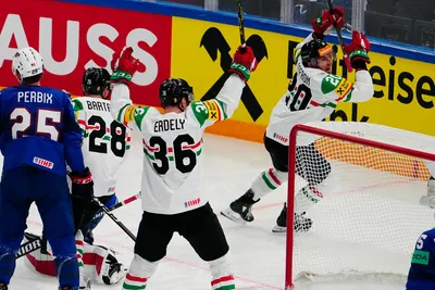 Hungary's Istvan Sofron, right, celebrates after scoring the opening goal during the group A match between United States and Hungary at the ice hockey world championship in Tampere, Finland, Sunday, May 14, 2023. (AP Photo/Pavel Golovkin)