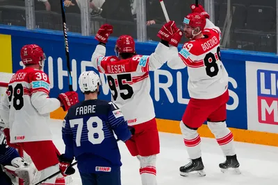 Denmark's Mikkel Boedker, right, celebrates after scoring his side's second goal during the group A match between France and Denmark at the ice hockey world championship in Tampere, Finland, Sunday, May 14, 2023. (AP Photo/Pavel Golovkin)