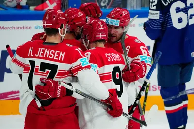 Denmark's team players celebrate after Nikolaj Ehlers scored the opening goal during the group A match between France and Denmark at the ice hockey world championship in Tampere, Finland, Sunday, May 14, 2023. (AP Photo/Pavel Golovkin)
