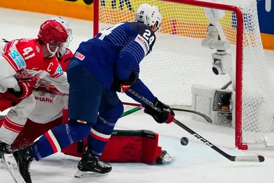 France's Justin Addamo, centre, scores his side's third goal during the group A match between France and Denmark at the ice hockey world championship in Tampere, Finland, Sunday, May 14, 2023. (AP Photo/Pavel Golovkin)