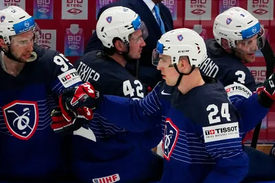 France's Justin Addamo, centre, celebrates after scoring his side's third goal during the group A match between France and Denmark at the ice hockey world championship in Tampere, Finland, Sunday, May 14, 2023. (AP Photo/Pavel Golovkin)