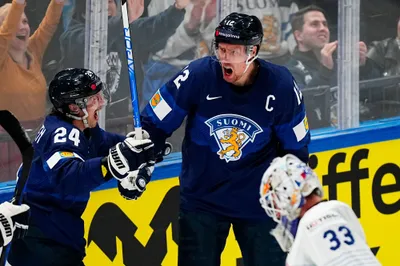 Finland's Marko Antilla, centre, celebrates after scoring his side's third goal during the group A match between Finland and France at the ice hockey world championship in Tampere, Finland, Wednesday, May 17, 2023. (AP Photo/Pavel Golovkin)