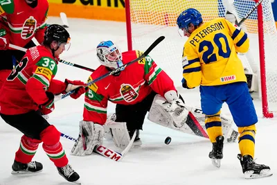 Sweden's Andre Petersson, right, tries to score past Hungary's goalie Dominik Horvath during the group A match between Hungary and Sweden at the ice hockey world championship in Tampere, Finland, Thursday, May 18, 2023. (AP Photo/Pavel Golovkin)