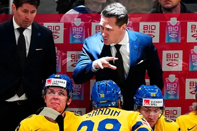 Sweden's head coach Sam Hallam gestures during the group A match between Hungary and Sweden at the ice hockey world championship in Tampere, Finland, Thursday, May 18, 2023. (AP Photo/Pavel Golovkin)