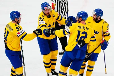 Sweden's Jacob de la Rose, second from left, celebrates with teammates after scoring his side's second goal during the group A match between Hungary and Sweden at the ice hockey world championship in Tampere, Finland, Thursday, May 18, 2023. (AP Photo/Pavel Golovkin)