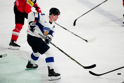 Finland's Olli Maatta controls the puck during the group A match between Austria and Finland at the ice hockey world championship in Tampere, Finland, Saturday, May 20, 2023. (AP Photo/Pavel Golovkin)
