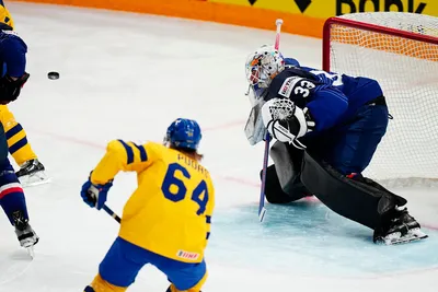 France's goalie Julian Junca misses the opening goal by Sweden's Par Lindholm during the group A match between Sweden and France at the ice hockey world championship in Tampere, Finland, Saturday, May 20, 2023. (AP Photo/Pavel Golovkin)