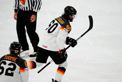 Germany's Wojciech Stachowiak, centre, celebrates after scoring the opening goal during the group A match between Germany and Hungary at the ice hockey world championship in Tampere, Finland, Sunday, May 21, 2023. (AP Photo/Pavel Golovkin)
