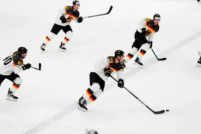 Germany's Nico Sturm, centre, controls the puck during the group A match between Germany and Hungary at the ice hockey world championship in Tampere, Finland, Sunday, May 21, 2023. (AP Photo/Pavel Golovkin)