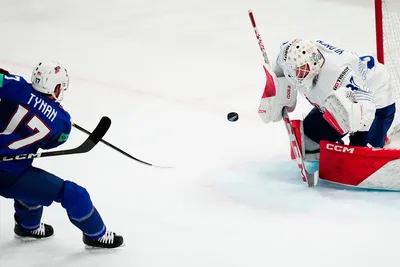 United States T J Tynan, left, scores his side's third goal past France's goalie Sebastian Ylonen during the group A match between United States and France at the ice hockey world championship in Tampere, Finland, Sunday, May 21, 2023. (AP Photo/Pavel Golovkin)