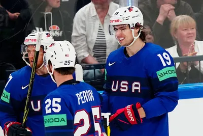 United States Cutter Gauthier, right, celebrates with teammates after scoring his side's second goal during the group A match between United States and France at the ice hockey world championship in Tampere, Finland, Sunday, May 21, 2023. (AP Photo/Pavel Golovkin)