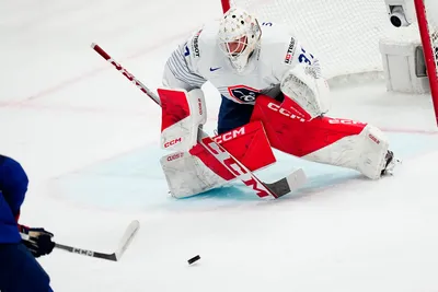 United States Cutter Gauthier, left, scores his side's second goal past France's goalie Sebastian Ylonen during the group A match between United States and France at the ice hockey world championship in Tampere, Finland, Sunday, May 21, 2023. (AP Photo/Pavel Golovkin)