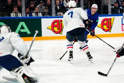 United States Cutter Gauthier, right, scores his side's fourth goal past France's goalie Quentin Papillon, left, during the group A match between United States and France at the ice hockey world championship in Tampere, Finland, Sunday, May 21, 2023. (AP Photo/Pavel Golovkin)