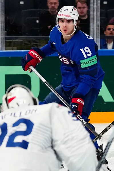 United States Cutter Gauthier, top, scores his side's fourth goal past France's goalie Quentin Papillon during the group A match between United States and France at the ice hockey world championship in Tampere, Finland, Sunday, May 21, 2023. (AP Photo/Pavel Golovkin)