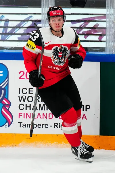 Austria's Marco Rossi celebrates after scoring his side's first goal during the group A match between Austria and Hungary at the ice hockey world championship in Tampere, Finland, Monday, May 22, 2023. (AP Photo/Pavel Golovkin)
