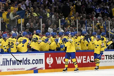 Sweden players celebrate the goal to 1-0 during the 2023 IIHF Ice Hockey World Championships preliminary round group A match between Sweden and USA in Tampere, Finland, Tuesday, May 23, 2023. (Emmi Korhonen/Lehtikuva via AP)

- .