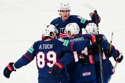United States Nick Bonino, centre back to the camera, celebrates with teammates after scoring his side's first goal during the group A match between Sweden and United States at the ice hockey world championship in Tampere, Finland, Tuesday, May 23, 2023. (AP Photo/Pavel Golovkin)