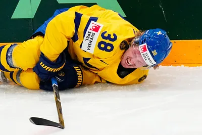 Sweden's Rasmus Sandin lays in pain after a battle with United States Michael Eyssimont during the group A match between Sweden and United States at the ice hockey world championship in Tampere, Finland, Tuesday, May 23, 2023. (AP Photo/Pavel Golovkin)