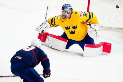 United States Lane Hutson, bottom left, scores his side's third goal past Sweden's goalie Lars Johansson during the group A match between Sweden and United States at the ice hockey world championship in Tampere, Finland, Tuesday, May 23, 2023. (AP Photo/Pavel Golovkin)