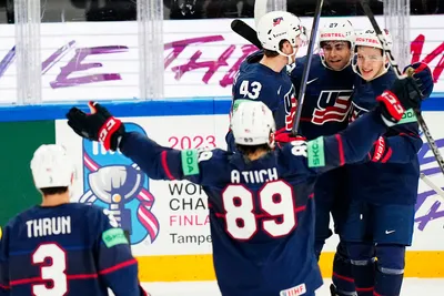 United States Lane Hutson, right, celebrates with teammates after scoring his side's third goal during the group A match between Sweden and United States at the ice hockey world championship in Tampere, Finland, Tuesday, May 23, 2023. (AP Photo/Pavel Golovkin)