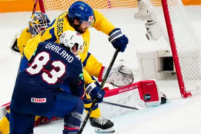 United States Conor Garland, centre, scores his side's second goal past Sweden's goalie Lars Johansson during the group A match between Sweden and United States at the ice hockey world championship in Tampere, Finland, Tuesday, May 23, 2023. (AP Photo/Pavel Golovkin)