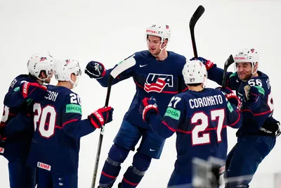 United States team players celebrate after Conor Garland scored his side's second goal during the group A match between Sweden and United States at the ice hockey world championship in Tampere, Finland, Tuesday, May 23, 2023. (AP Photo/Pavel Golovkin)