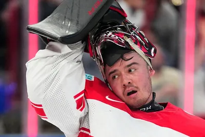 Denmark's goalie George Sorensen reacts after Finland's Ville Pokka scored his side's third goal during the group A match between Finland and Denmark at the ice hockey world championship in Tampere, Finland, Tuesday, May 23, 2023. (AP Photo/Pavel Golovkin)