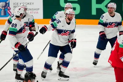 United States' Nick Perbix, center, celebrates with teammates after scoring his side's second goal during the quarterfinal match between United States and Czech Republic at the ice hockey world championship in Tampere, Finland, Thursday, May 25, 2023. (AP Photo/Pavel Golovkin)