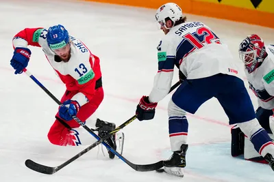 Czech Republic's Jiri Smejkal, left, and United States Dylan Samberg battle for the puck during the quarterfinal match between United States and Czech Republic at the ice hockey world championship in Tampere, Finland, Thursday, May 25, 2023. (AP Photo/Pavel Golovkin)