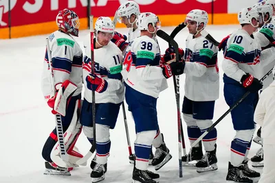 United States team players celebrate as they won the quarterfinal match between United States and Czech Republic at the ice hockey world championship in Tampere, Finland, Thursday, May 25, 2023. (AP Photo/Pavel Golovkin)