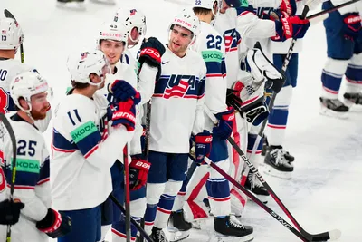 United States Matt Coronato, centre, celebrates with teammates as they won the quarterfinal match between United States and Czech Republic at the ice hockey world championship in Tampere, Finland, Thursday, May 25, 2023. (AP Photo/Pavel Golovkin)