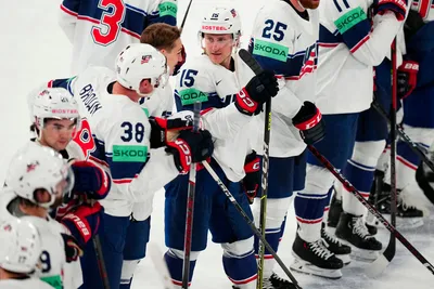 United States Scott Perunovich, centre, celebrate with teammates as they won the quarterfinal match between United States and Czech Republic at the ice hockey world championship in Tampere, Finland, Thursday, May 25, 2023. (AP Photo/Pavel Golovkin)