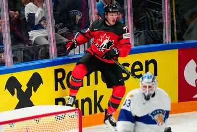 Canada's Samuel Blais celebrates after scoring his side's second goal past Finland's goalie Emil Larmi during the quarterfinal match between Canada and Finland at the ice hockey world championship in Tampere, Finland, Thursday, May 25, 2023. (AP Photo/Pavel Golovkin)